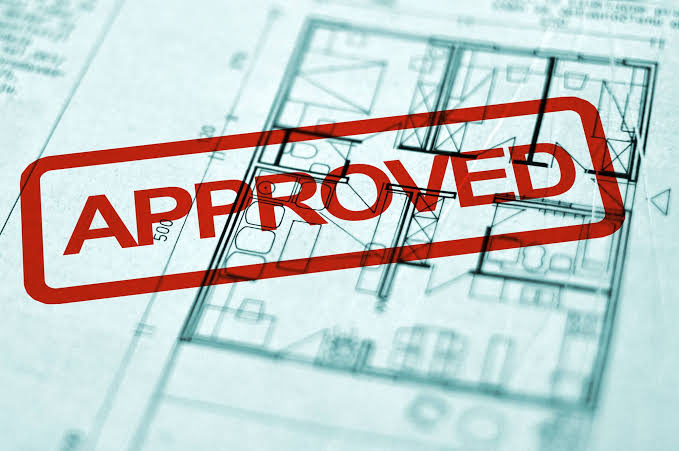 Architectural floor plan marked with a red approved stamp